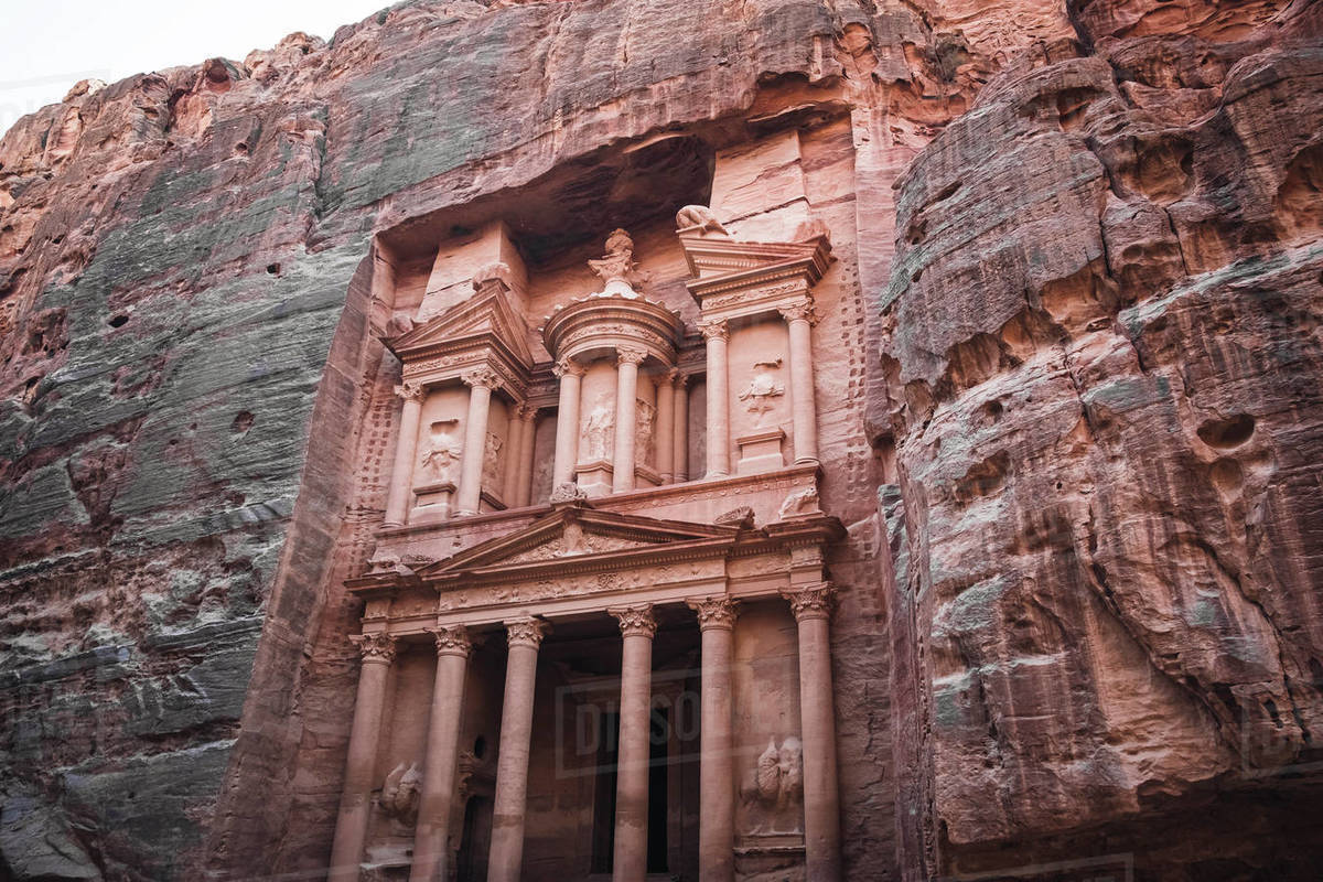 Treasury (Al Khazneh) monument carved into the stone on the side