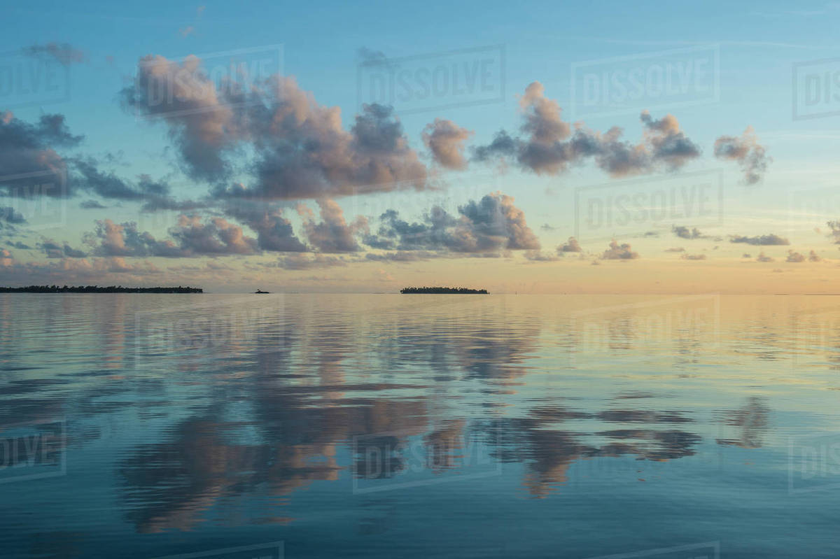 Sunset over the calm waters of Tikehau, Tuamotus, French Polynesia