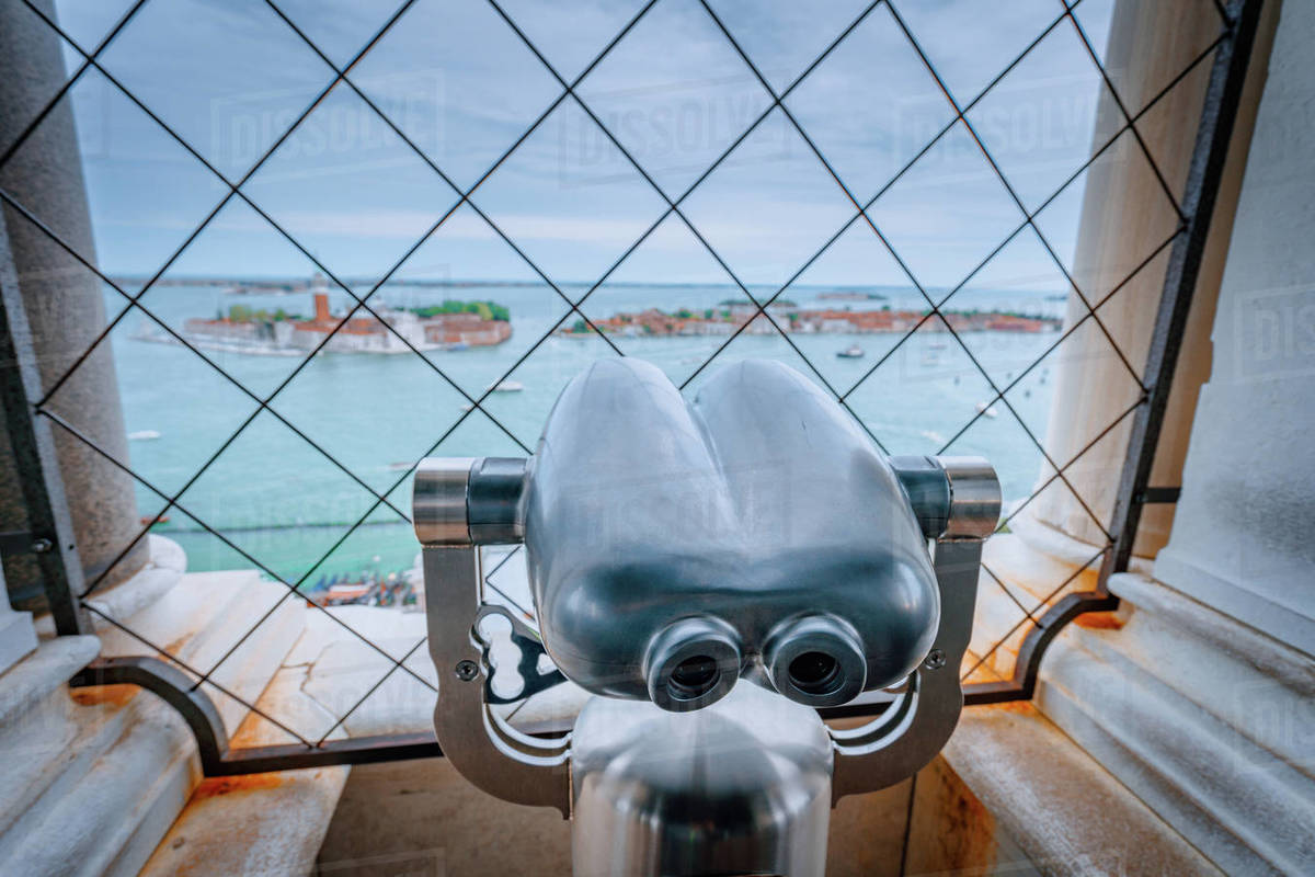 Pay binoculars in the Clock Tower of Venice, Italy with the Basilica