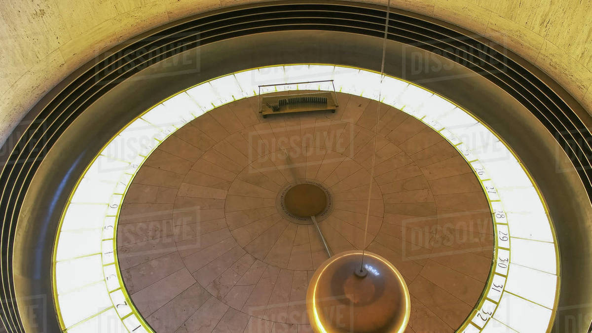 close up of the foucault pendulum at griffith observatory, a foucault