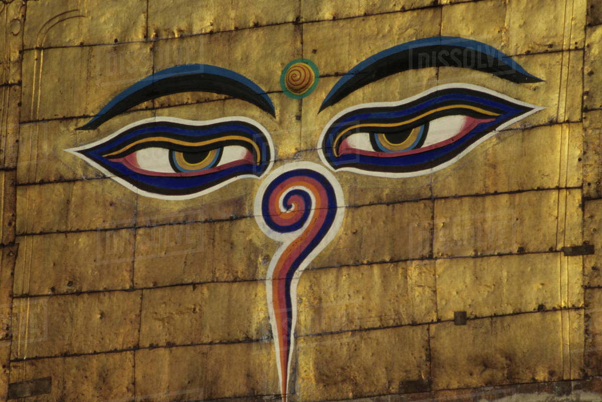 Nepal, Kathmandu. Watchful eyes of Buddha on gilded walls atop the dome