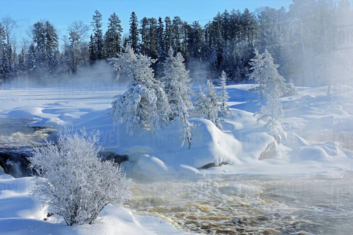 Canada, Ontario, Vermillion Bay. Mist on Wabigoon River at sunrise