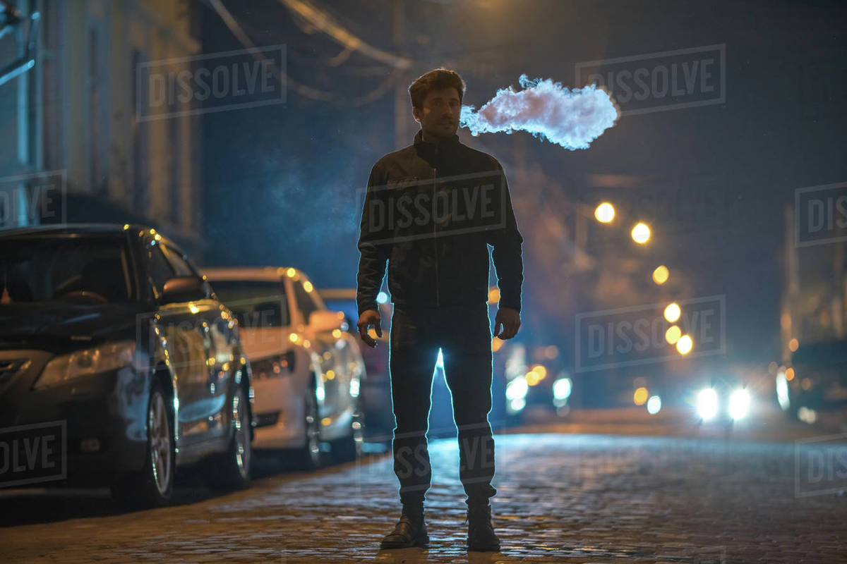 The man smoke on the Evening night Telephoto lens