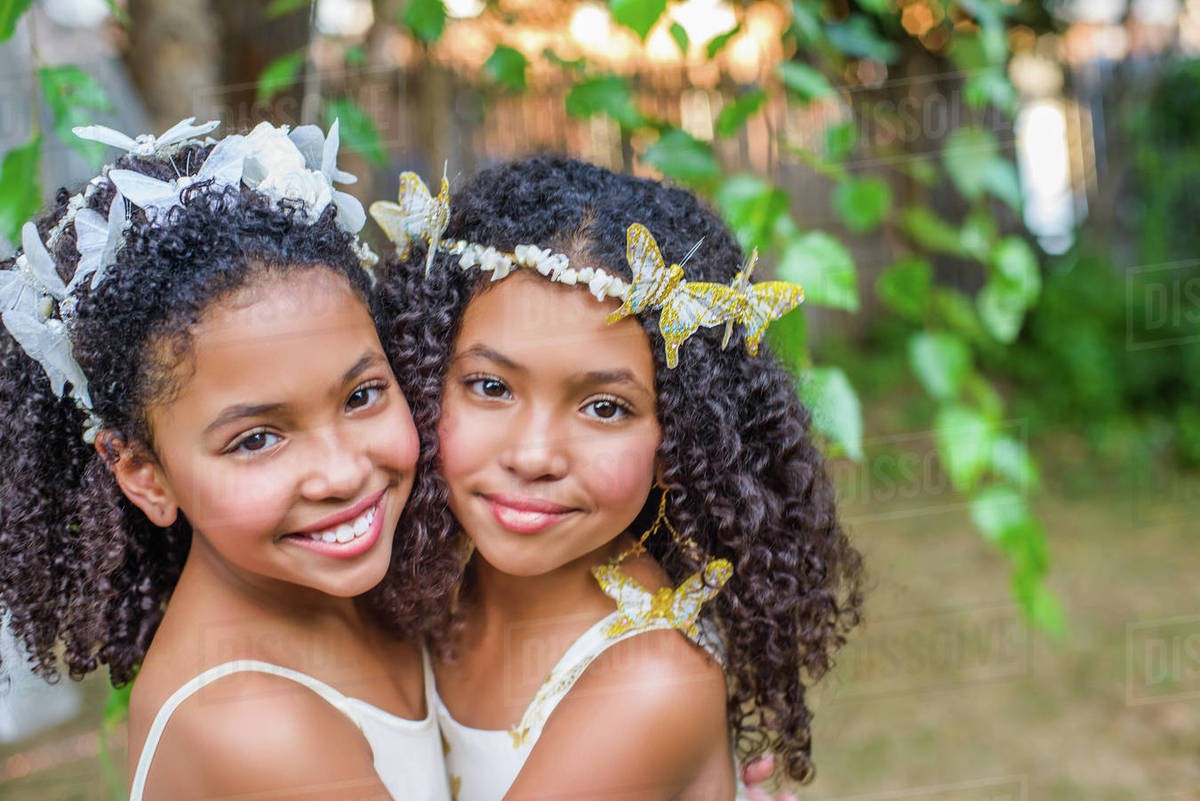 Portrait of two girls, wearing butterflies in hair Royalty-free stock photo