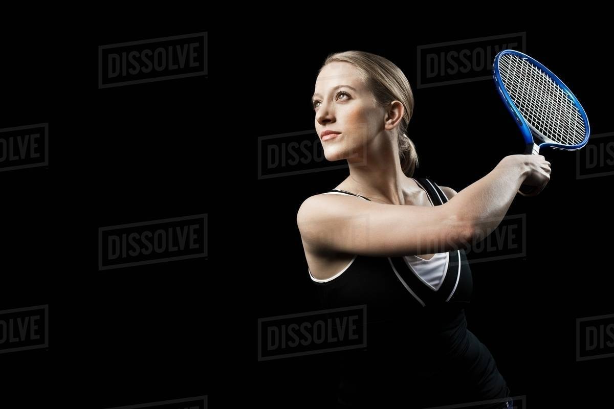 Tennis player holding racket Stock Photo Dissolve