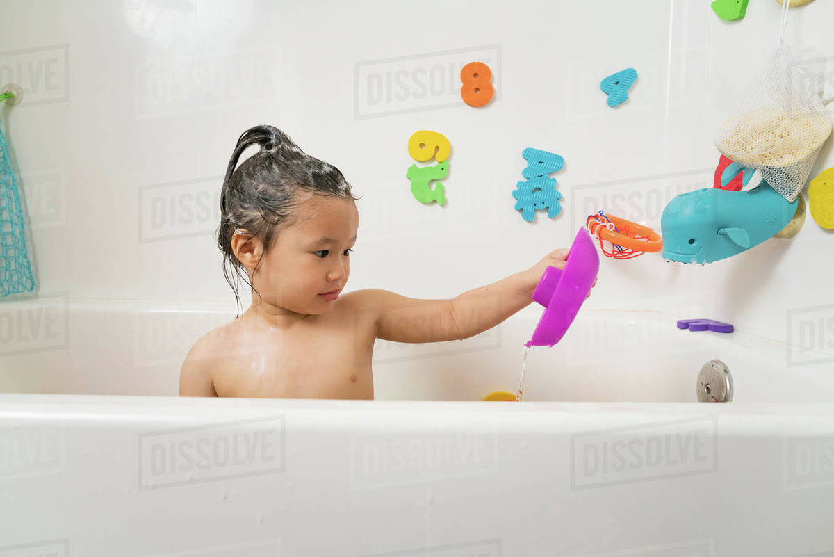 Little boy in bath tub at bath time Stock Photo Dissolve