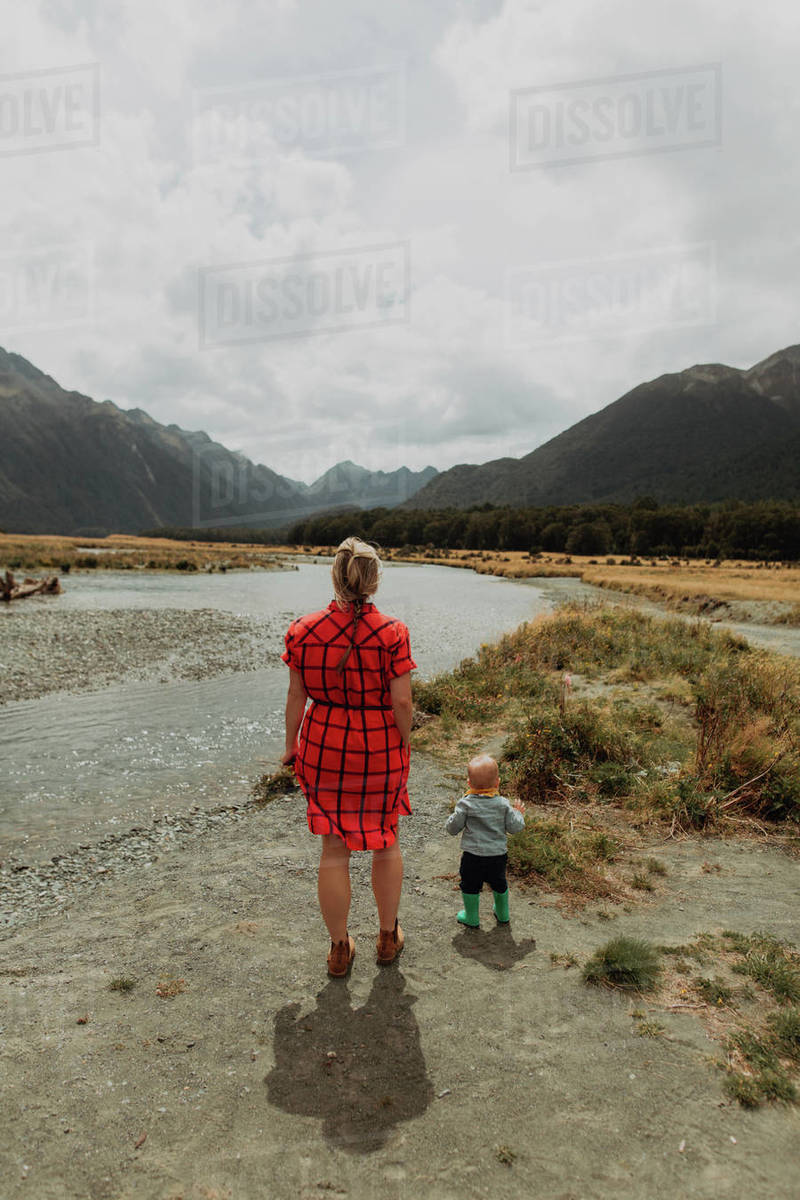 Mother and baby by lake, Queenstown, Canterbury, New Zealand Stock