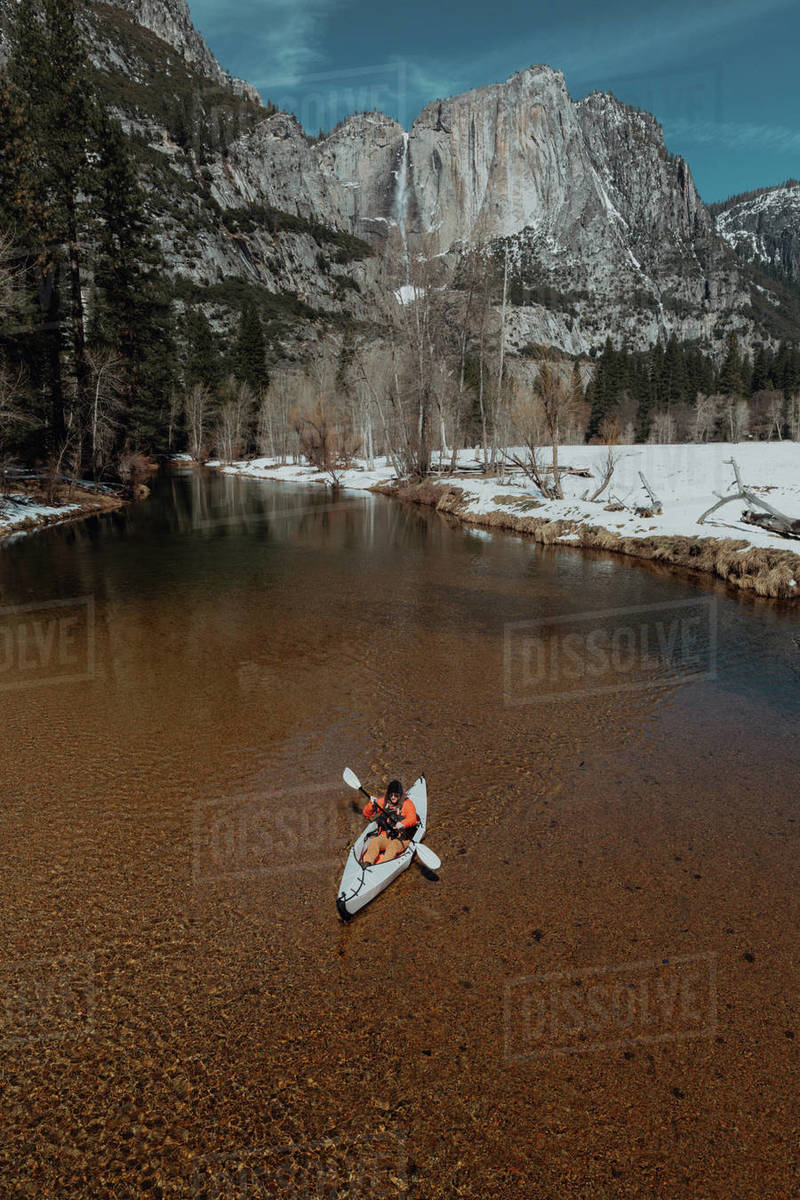 Man kayaking in lake, Yosemite Village, California, United States