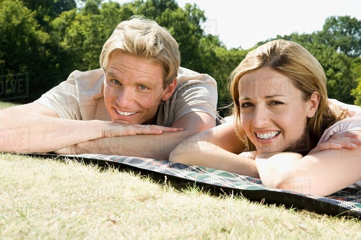 Couple lying on blanket Stock Photo Dissolve