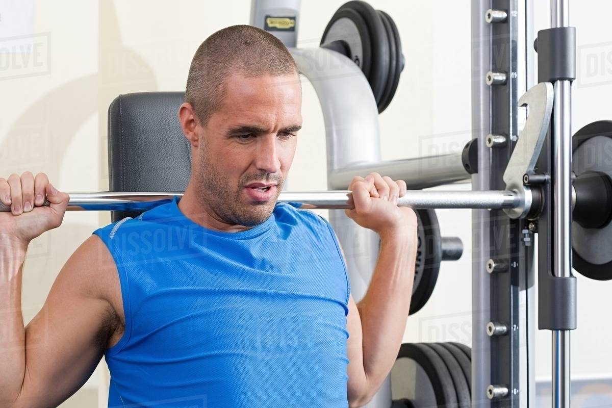 Man weight training - Stock Photo - Dissolve