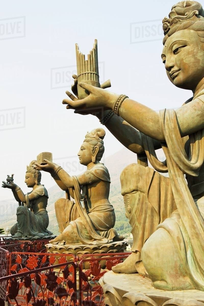 Statues near tian tan buddha Stock Photo Dissolve