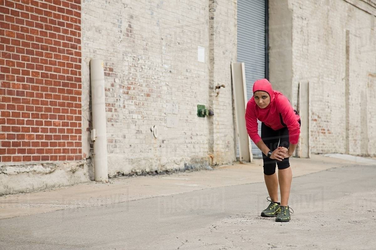 Runner in urban setting Stock Photo Dissolve