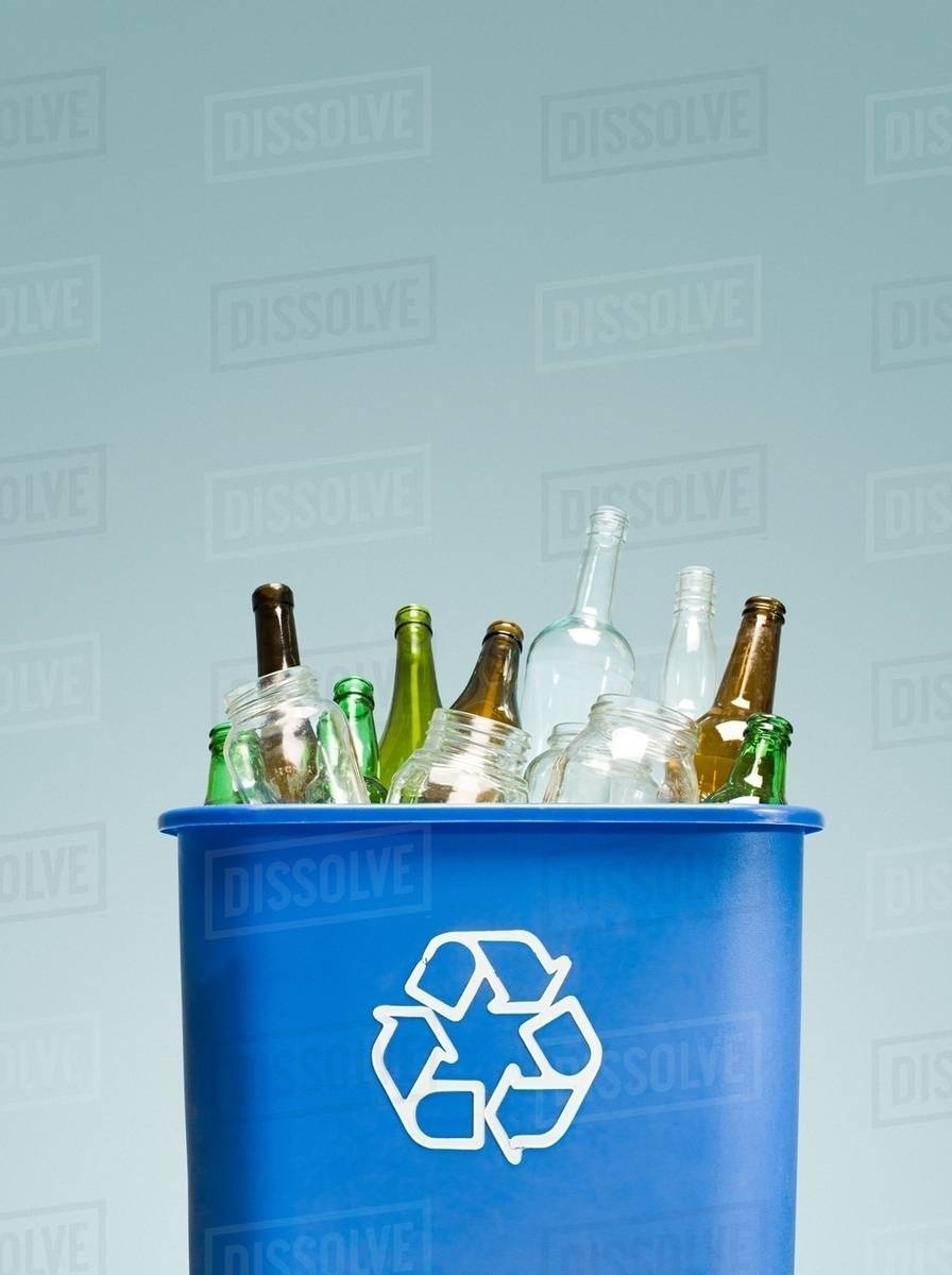 Glass bottles in a recycling bin Stock Photo Dissolve