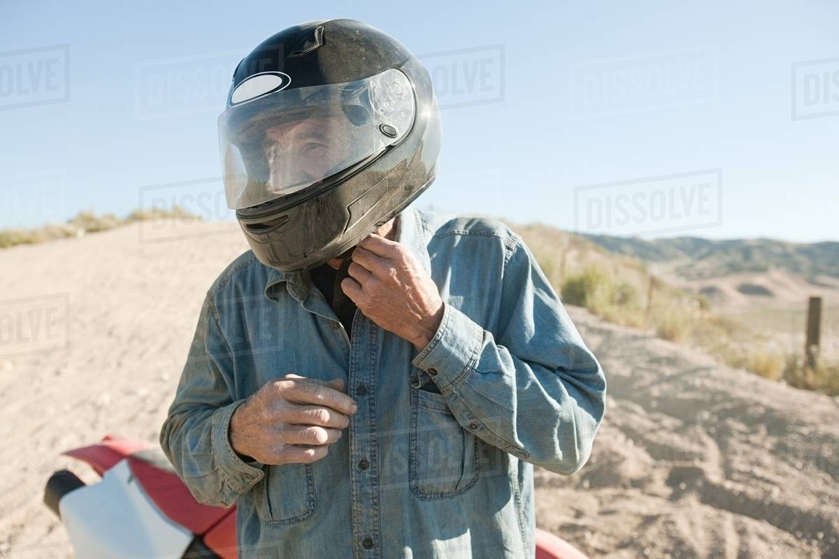 Man wearing crash helmet Stock Photo Dissolve