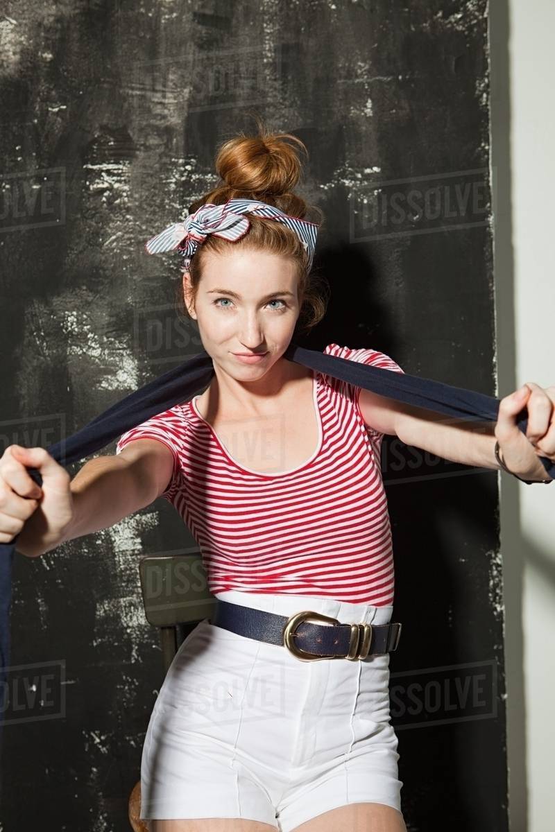 Young woman wearing white hot pants at party Stock Photo Dissolve