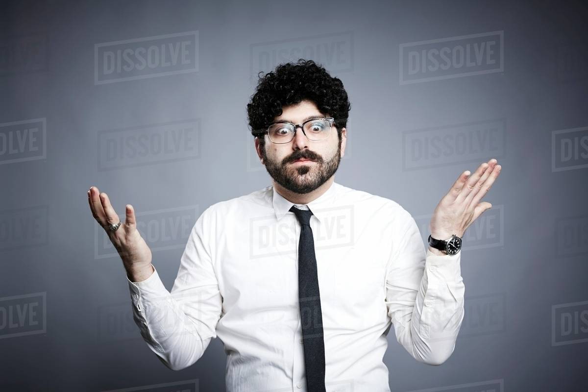 Portrait of young man, hands open in questioning expression - Royalty ...