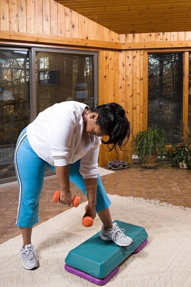 Exhausted woman exercising - Royalty-free Stock Photo | Dissolve