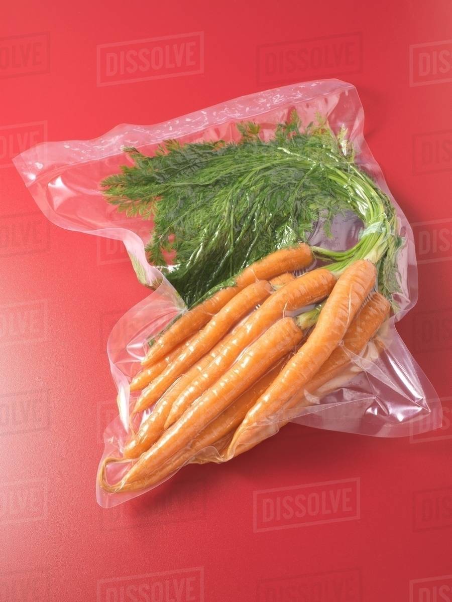 Vacuum packed carrots Stock Photo Dissolve