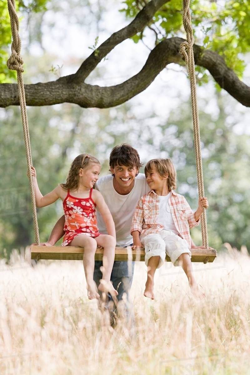 children on swing with