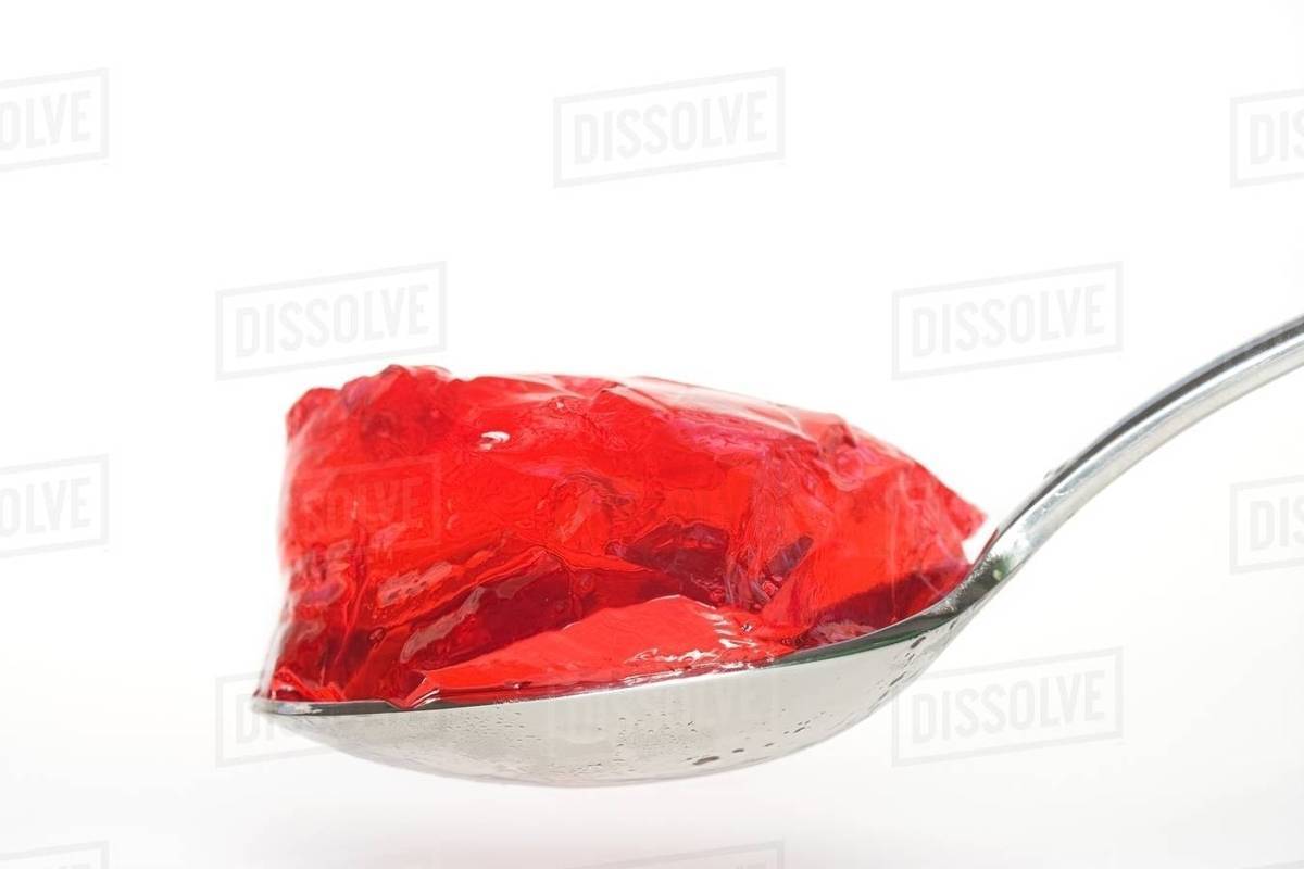 Jelly on a spoon Stock Photo Dissolve