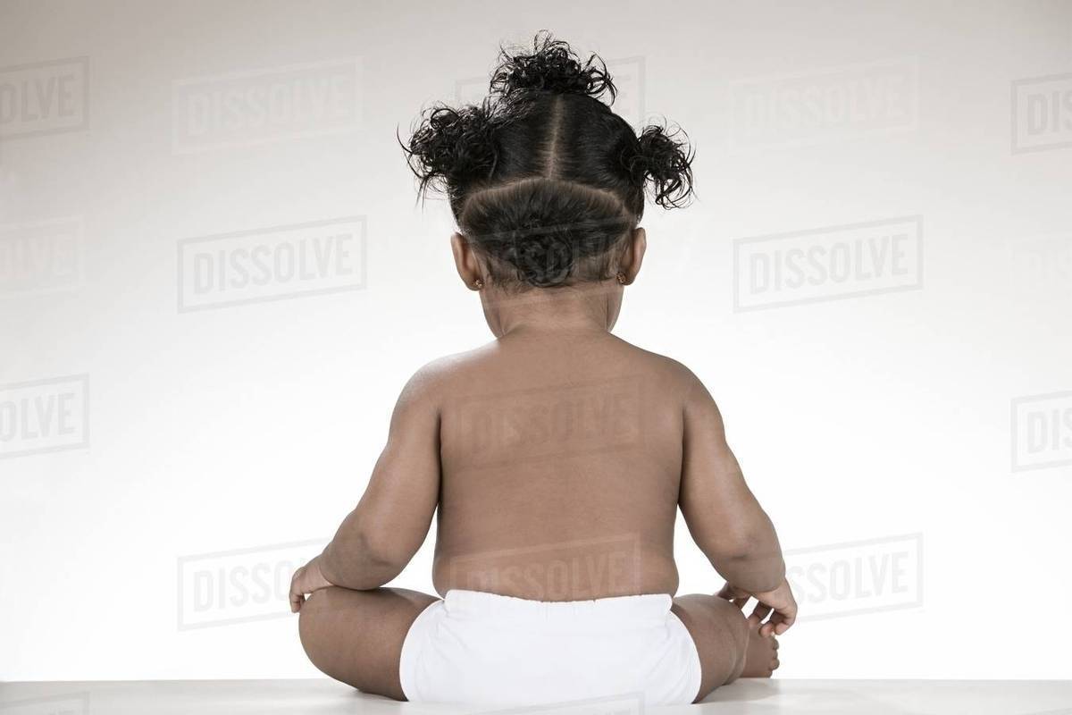 Rear view of a baby girl Stock Photo Dissolve