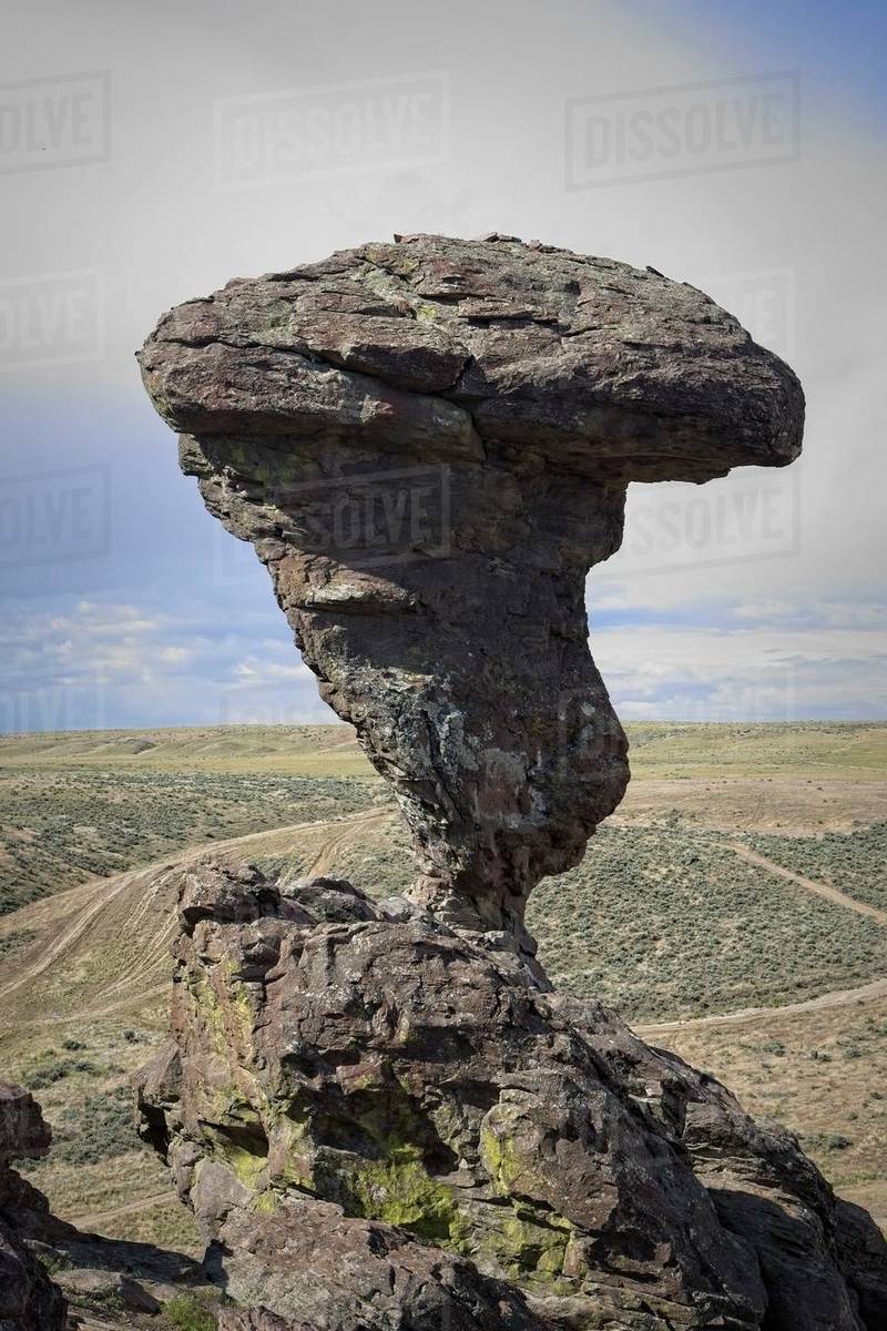 A photo of the famous landmark Balanced ROck against a partly cloudy