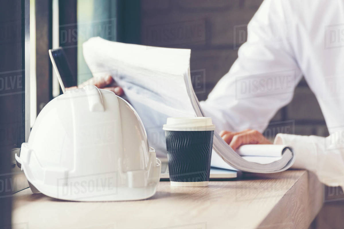 Smart engineer working outdoor at the coffee shop. Stock Photo Dissolve