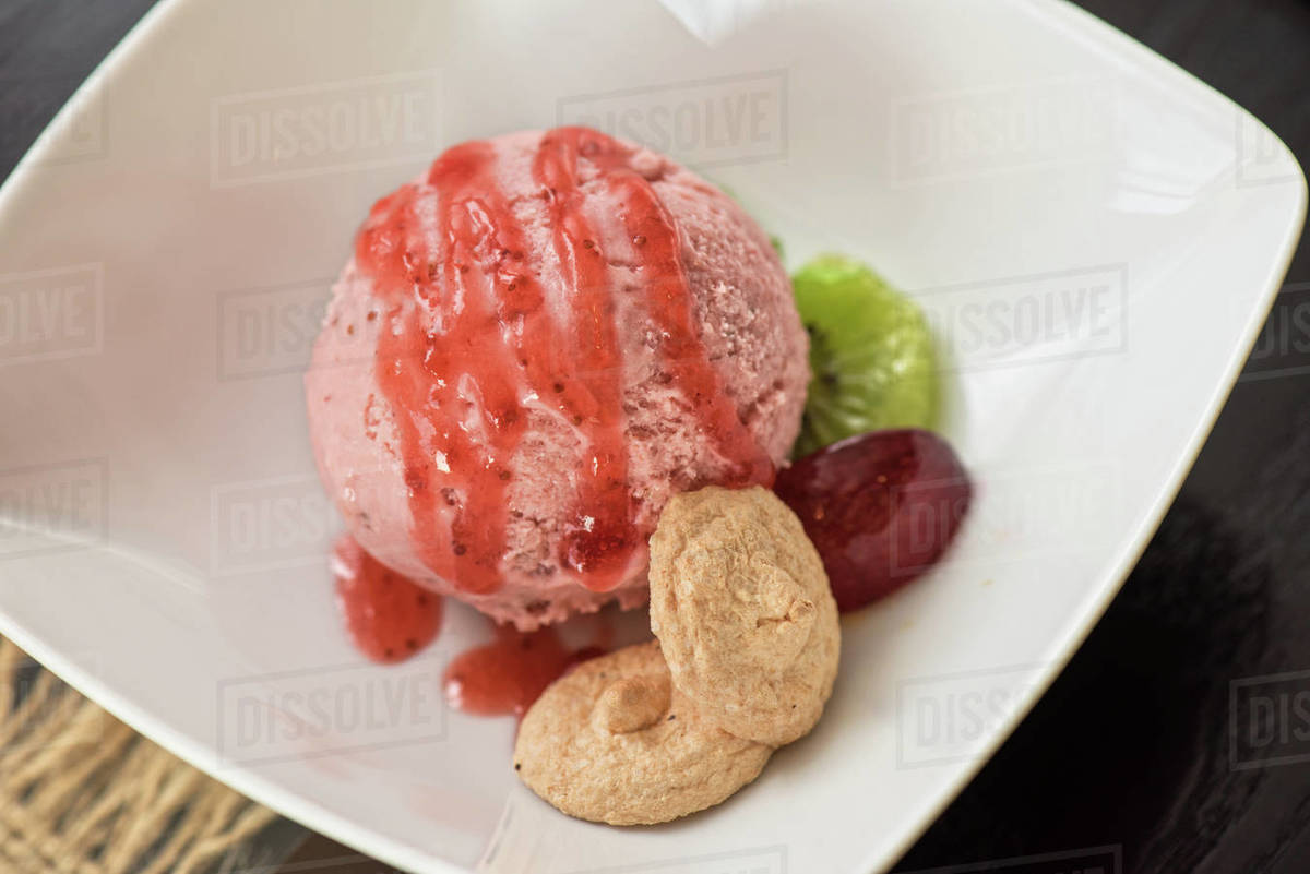 Fruit strawberry ice cream in plate Stock Photo Dissolve