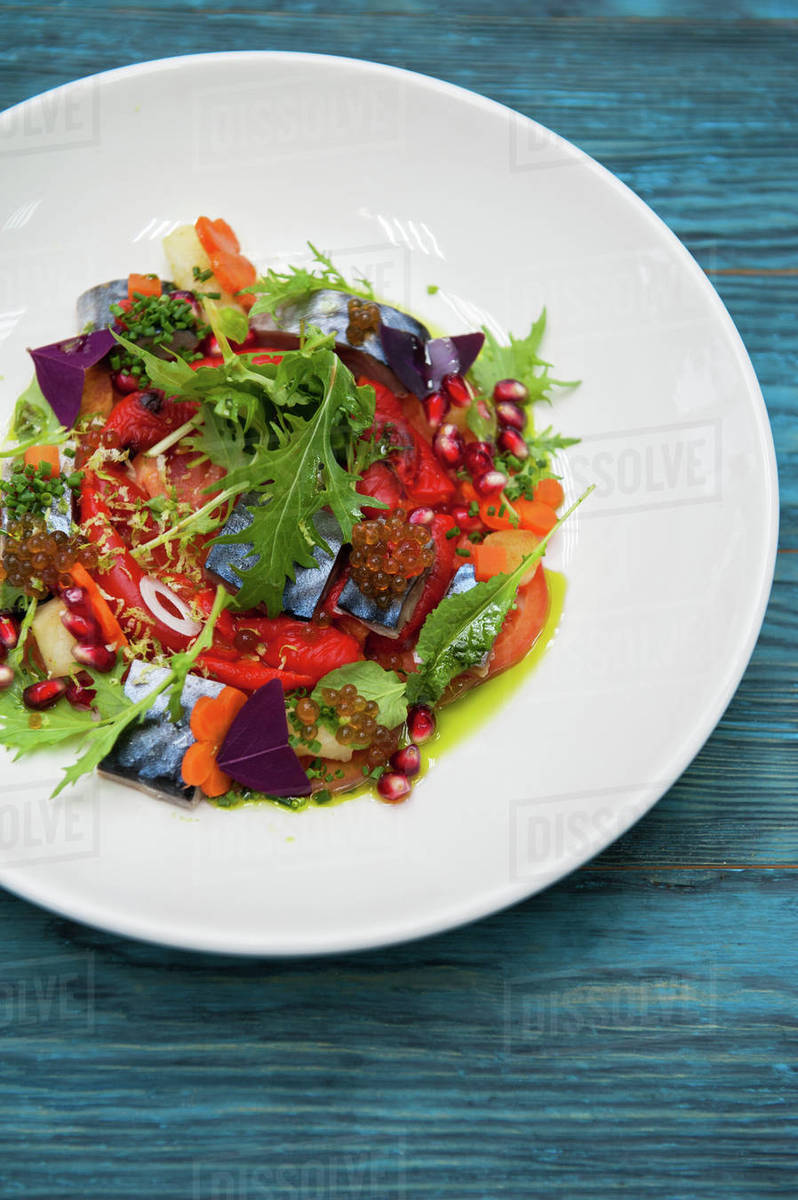 Escabeche fish dish with caviar mackerel in marinade with vegetable