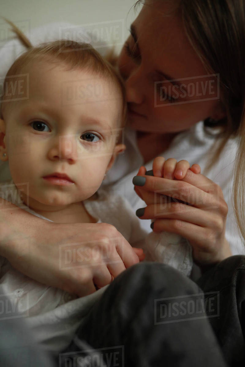 Portrait mother with her little daughter. Closeup. Stock Photo Dissolve