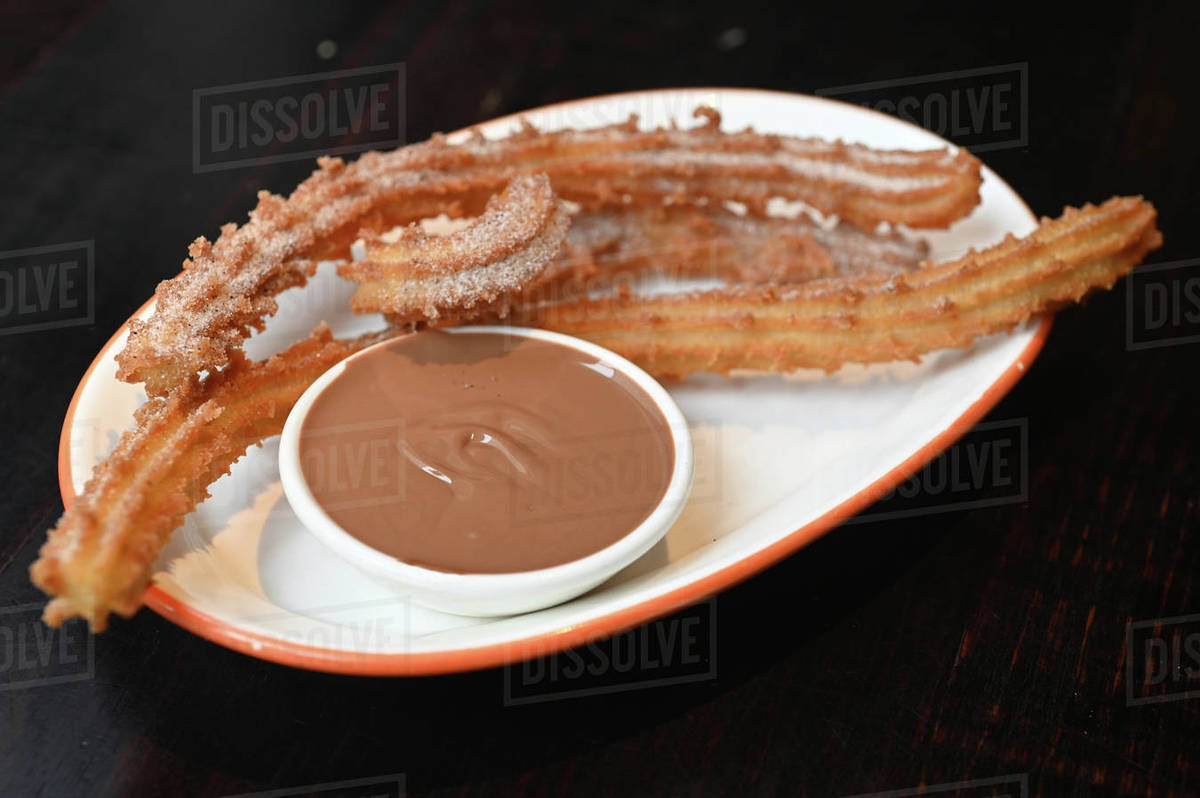 Traditional homemade Spanish Churro Pastry served with chocolate