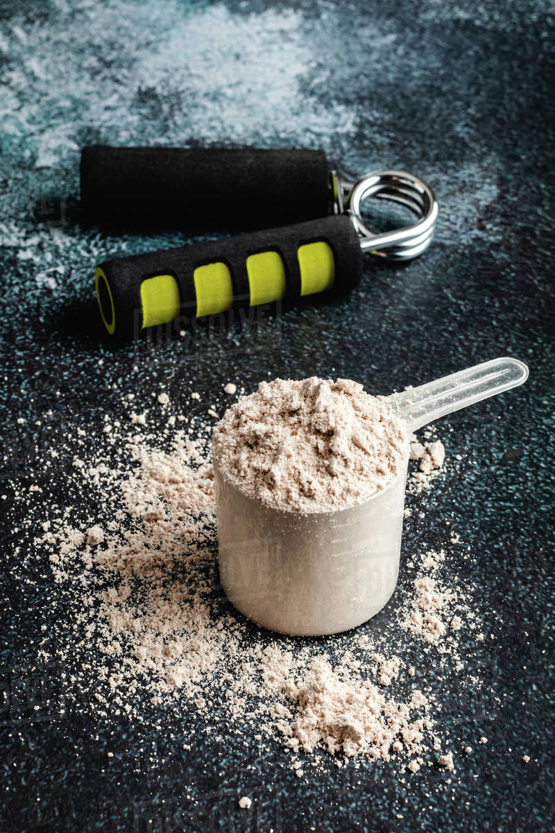 Scoops filled with protein powder Stock Photo Dissolve