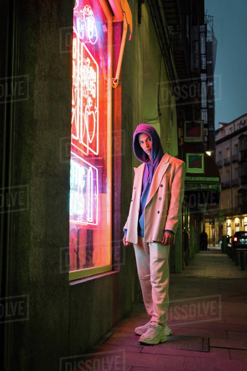 Cinematic urban portrait with soft street lighting and realistic city background