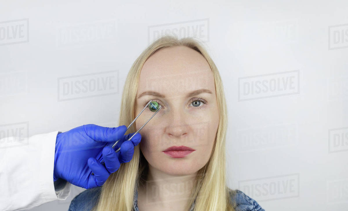 Conceptual shot of an eye crystalline lens replacement. Ophthalmic surgery. Return of sight