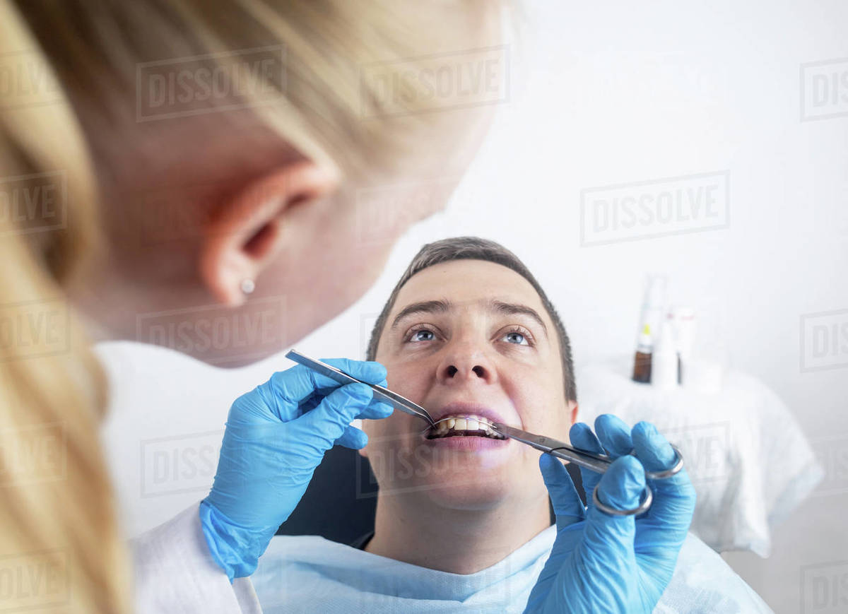 Installation of braces, bridges and a dental plate to correct teeth. An