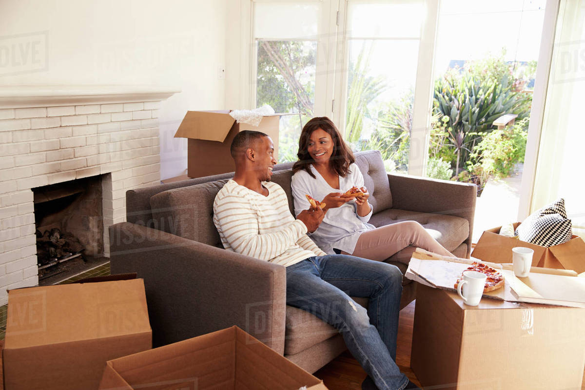 Take A Break On Sofa With Pizza Moving Day Stock Photo Take A Break On Sofa With Pizza Moving Day
