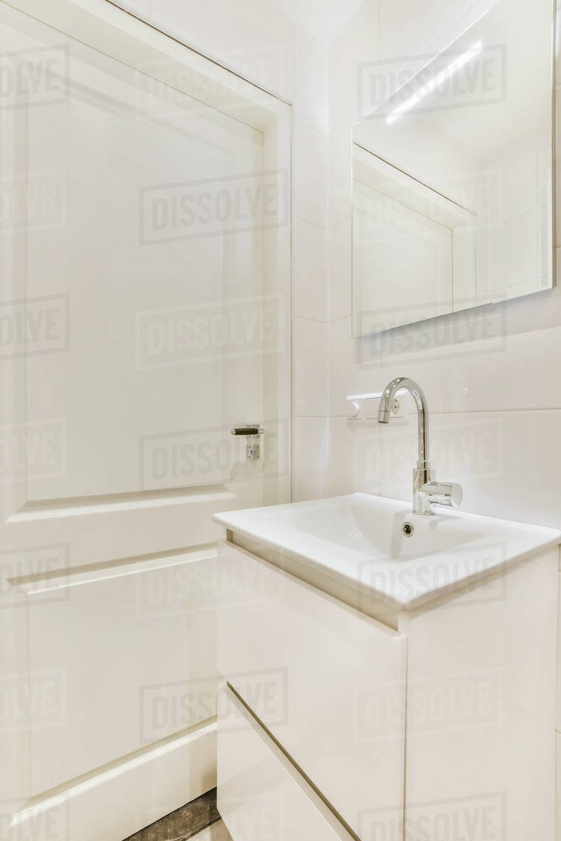 An allwhite bathroom in an elegant apartment Stock Photo Dissolve