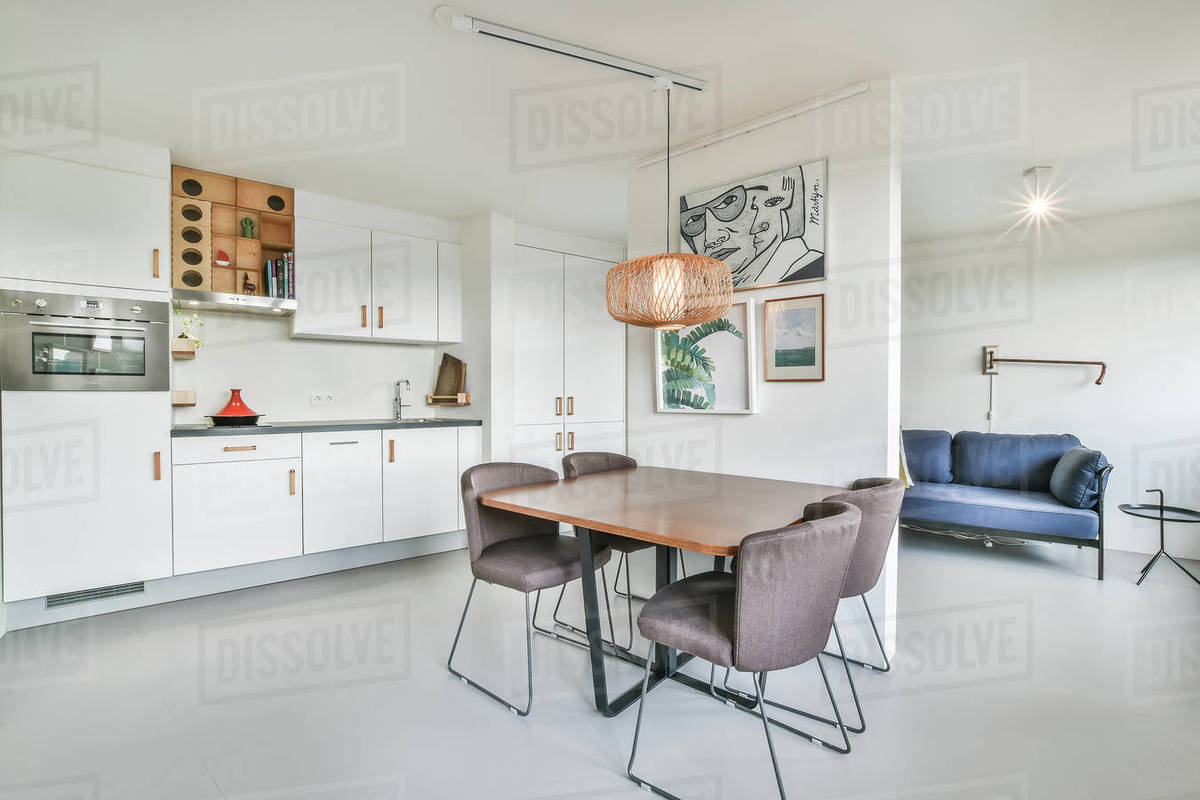 Bright dining room with decorative table and chairs Stock Photo Dissolve