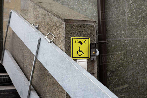 Yellow icon with call button for the disabled people for lifting ...