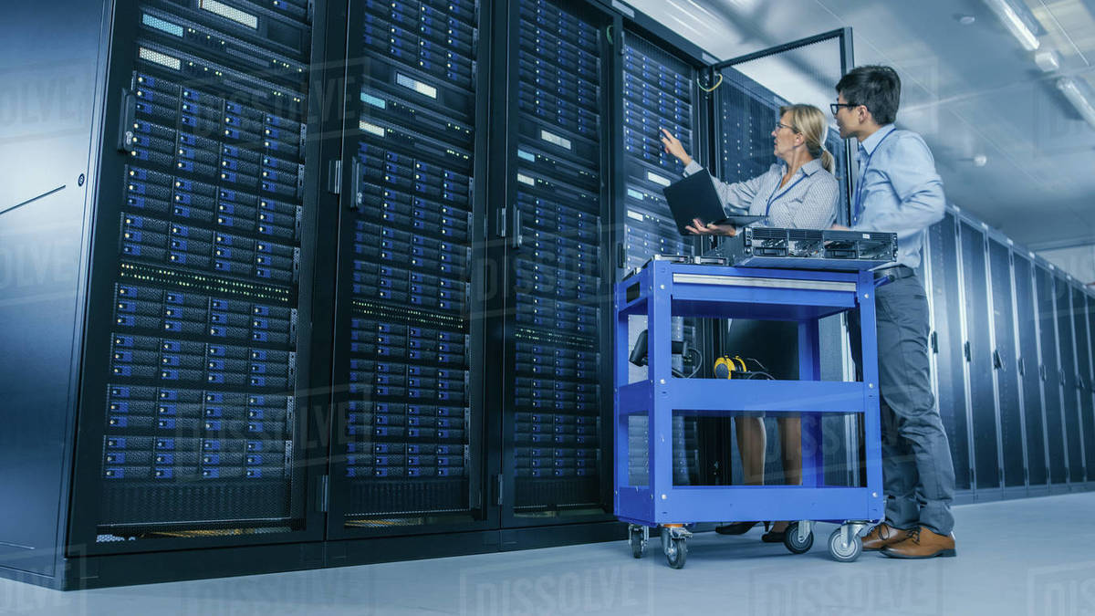 in-the-modern-data-center-engineer-and-it-specialist-work-with-server