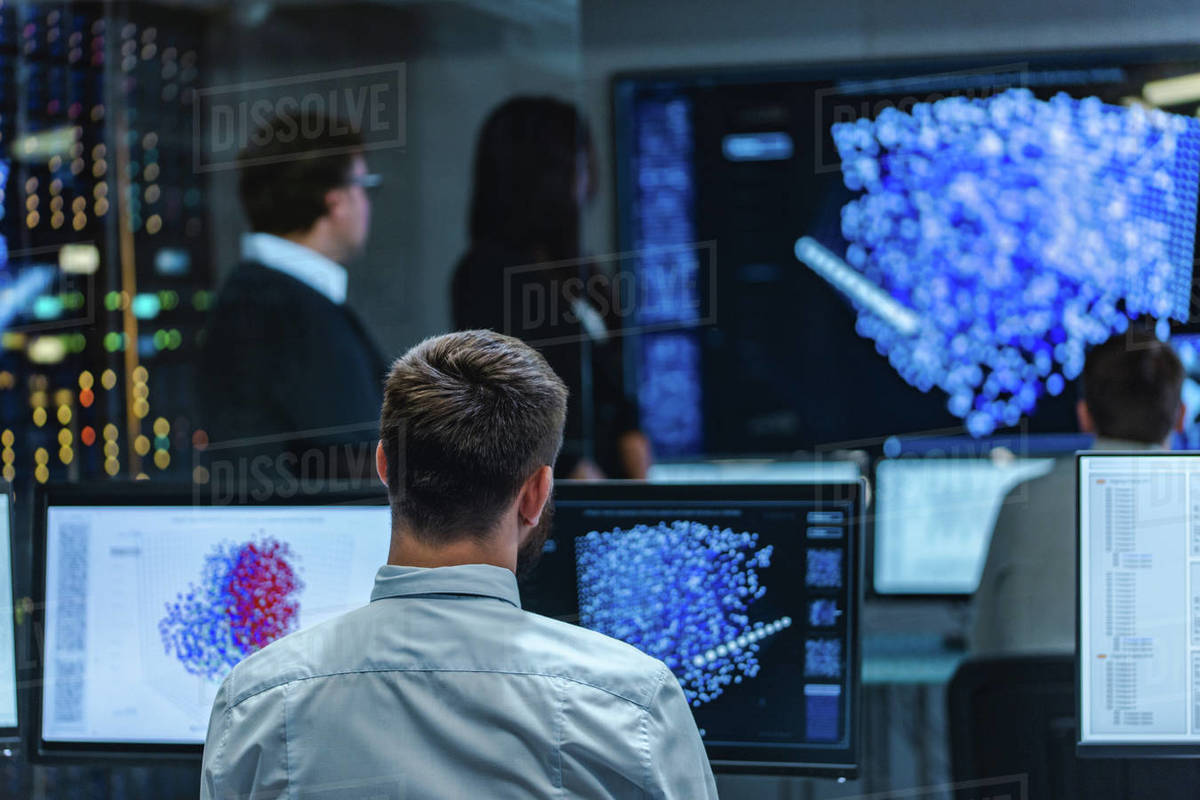 Backshot of a Male Computer Engineer Works on a Neural Network
