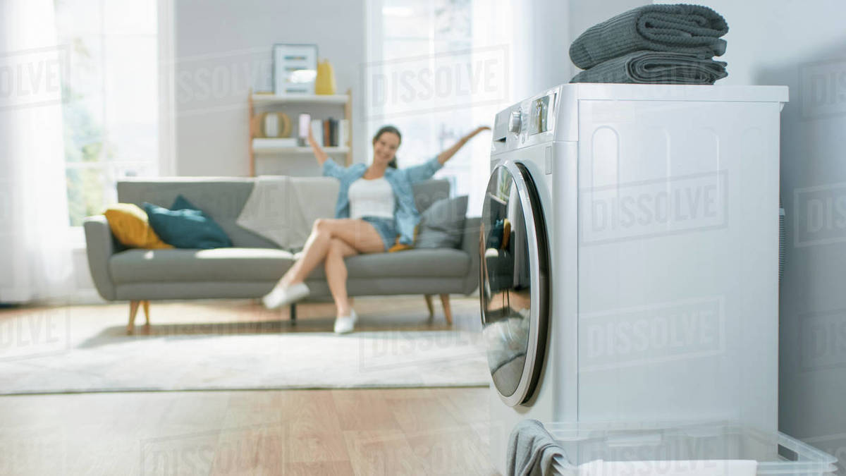 Shot of a Modern Technologically Advanced Washing Machine Working in a Bright and Spacious