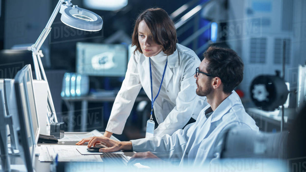 Machine Engine Development Engineer Working on Computer at His Desk ...