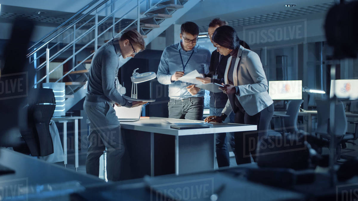 Diverse Team of Electronics Development Engineers Standing at the Desk