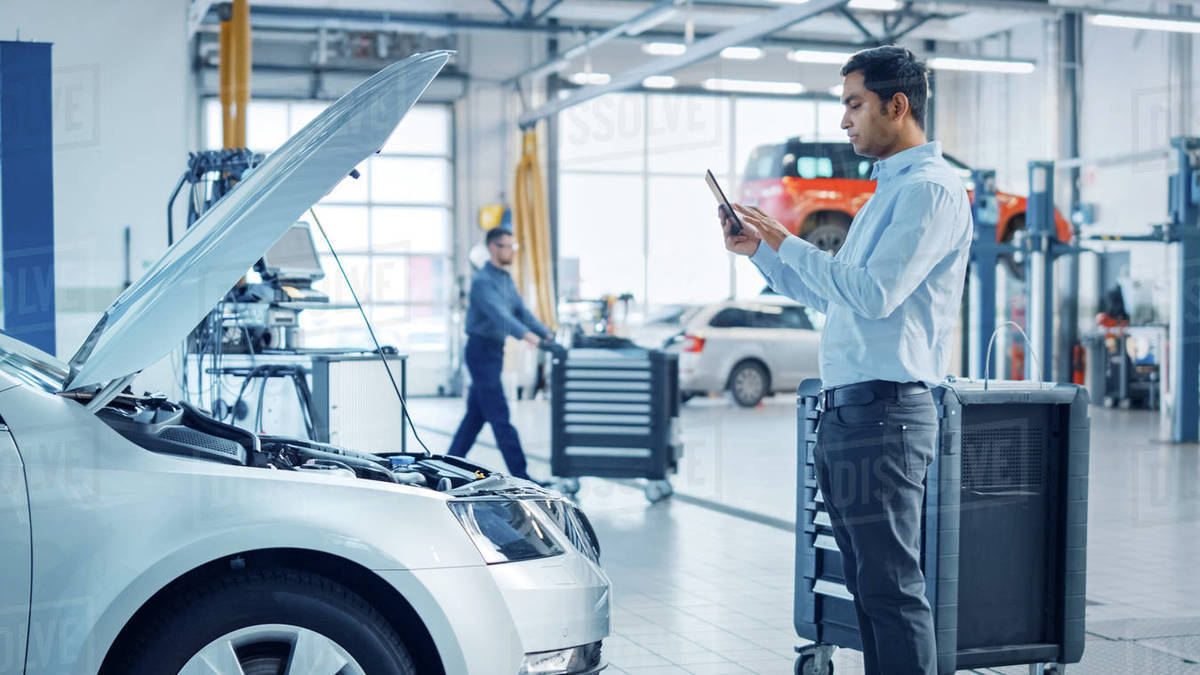 Car Service Manager Uses a Tablet Computer with an Augmented Reality