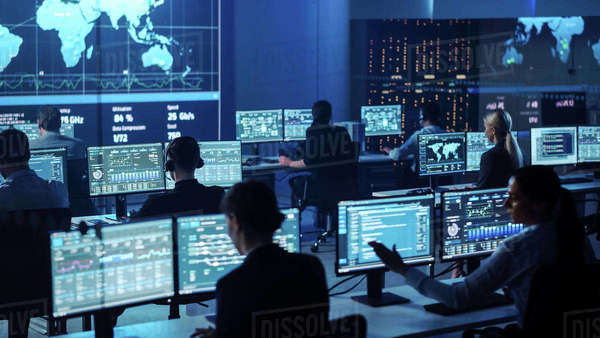 Team of Professional Computer Data Science Engineers Work on Desktops ...