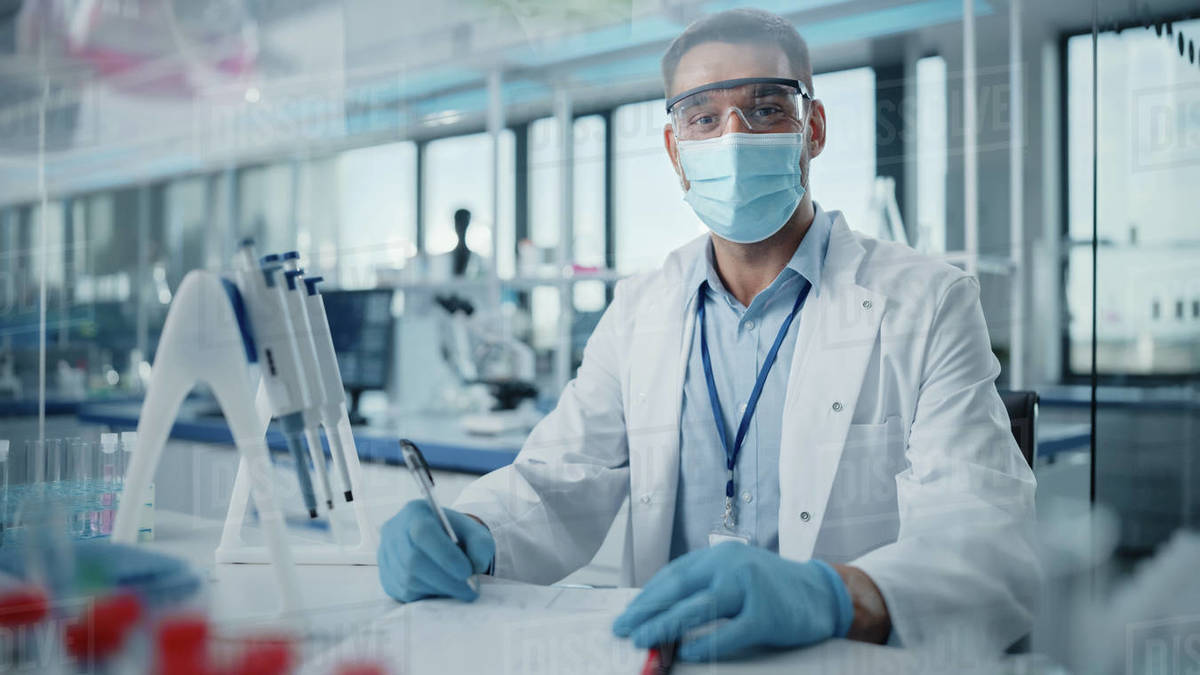 Medical Research Laboratory Portrait of Male Scientist Wearing Face