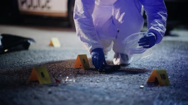 Forensics Finding Murder Weapon on Crime Scene at Night and Packing it ...