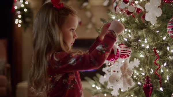 medium panning shot of family decorating christmas tree royalty free stock video - Videos Of Decorated Christmas Trees medium panning shot of family decorating christmas tree royalty free stock video - Videos Of Decorated Christmas Trees