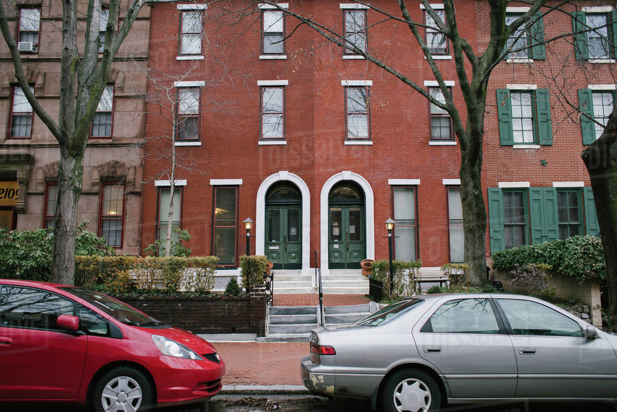 Cars parked on a street against residential building, Philadelphia